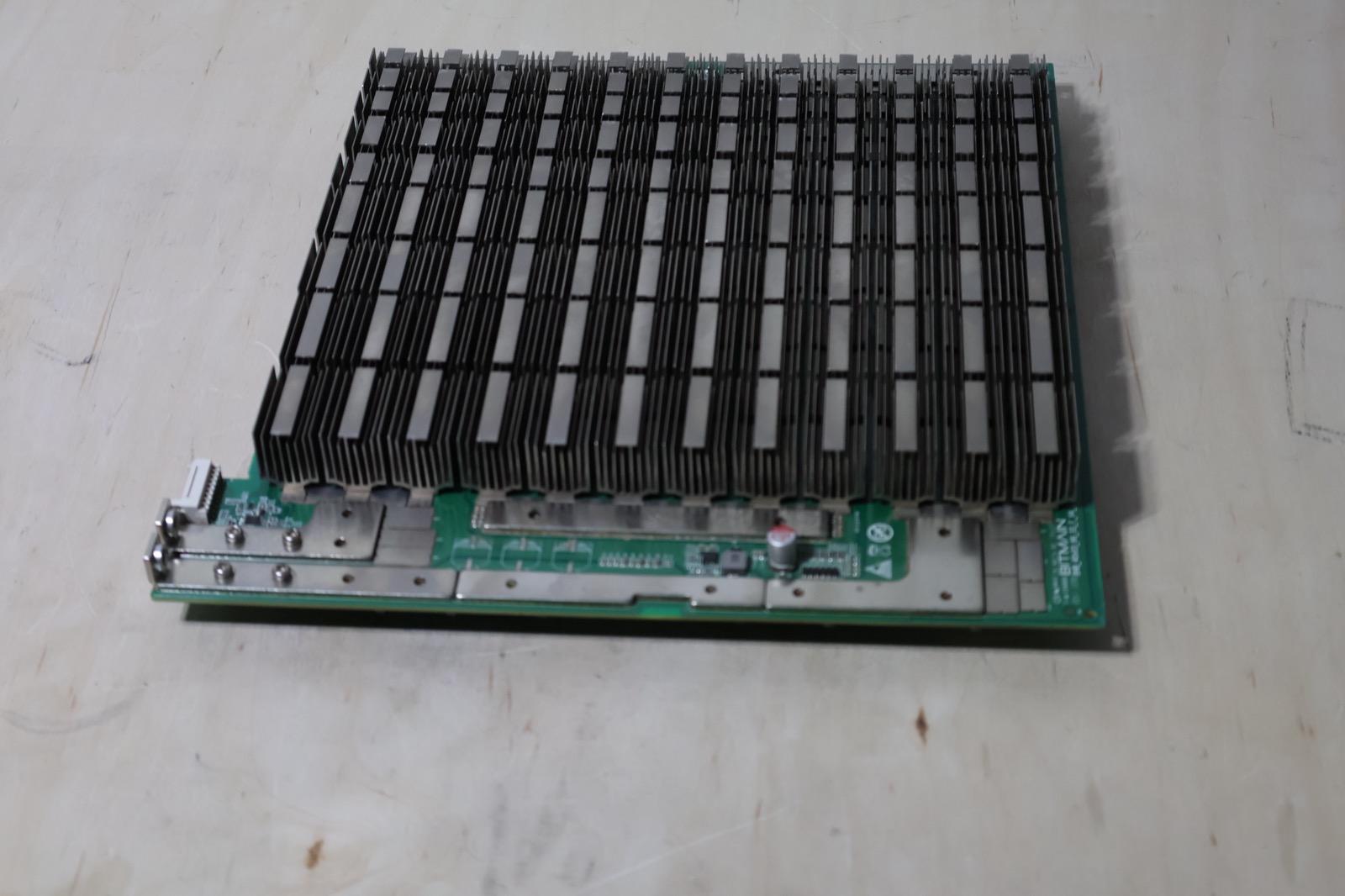 Bare S19 hashboard with heatsinks